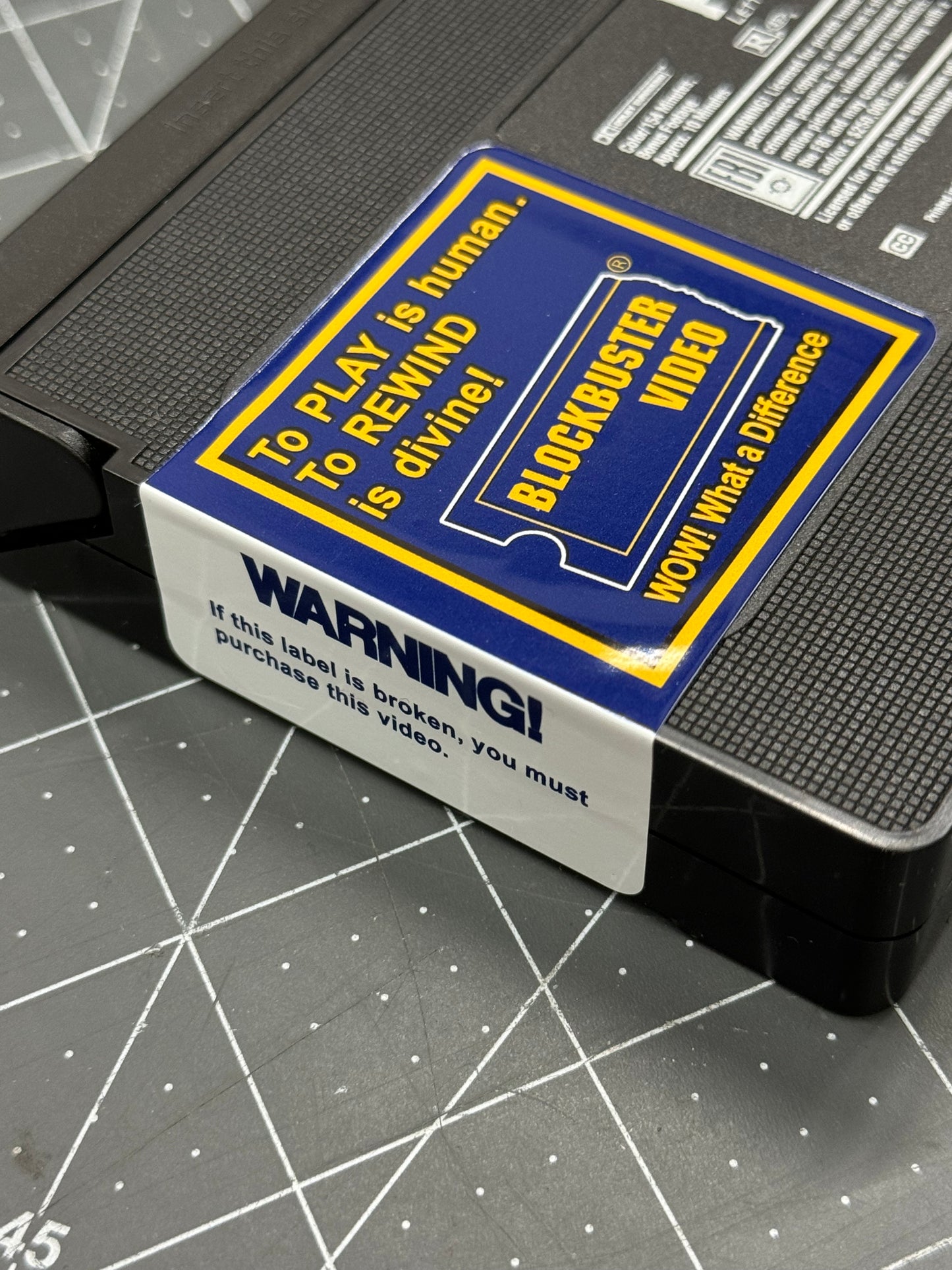 Blockbuster Video WARNING + “To Play is Human, to Rewind is divine!” VHS Sticker