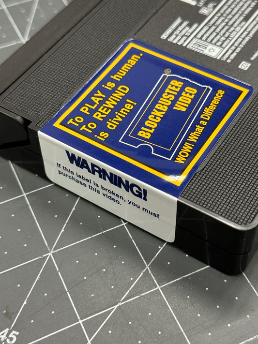 Blockbuster Video WARNING + “To Play is Human, to Rewind is divine!” VHS Sticker