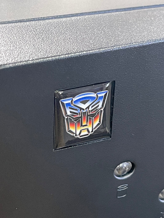> Transformers < Autobot Logo Case Badge Sticker - Dome Black